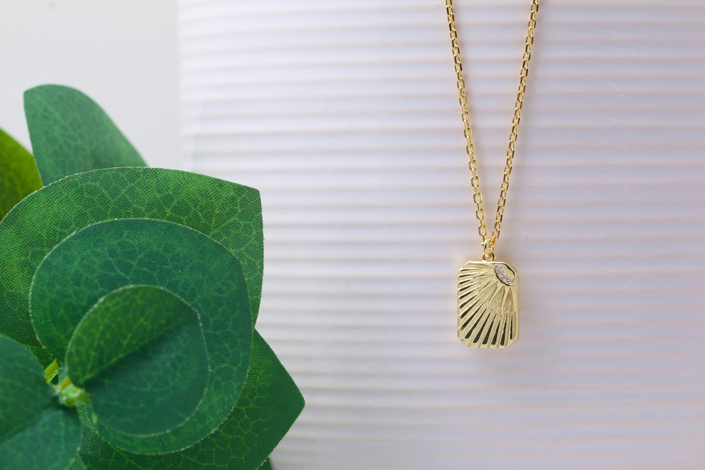 Gold sunburst necklace deals